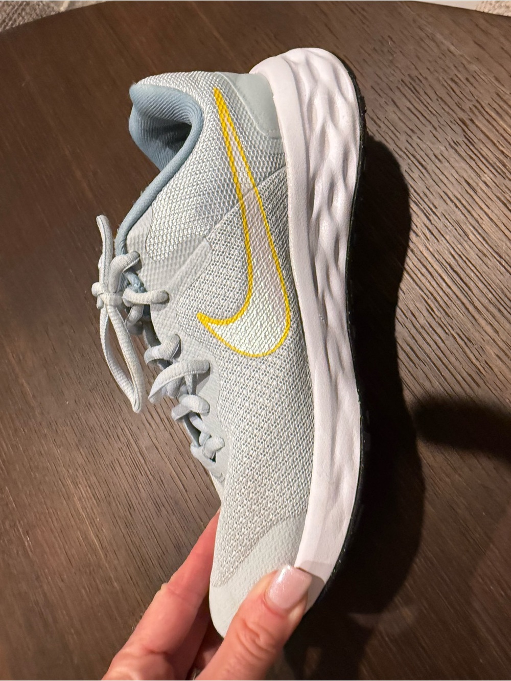 Nike Women's Light Blue Running Sneakers with Yellow Swoosh